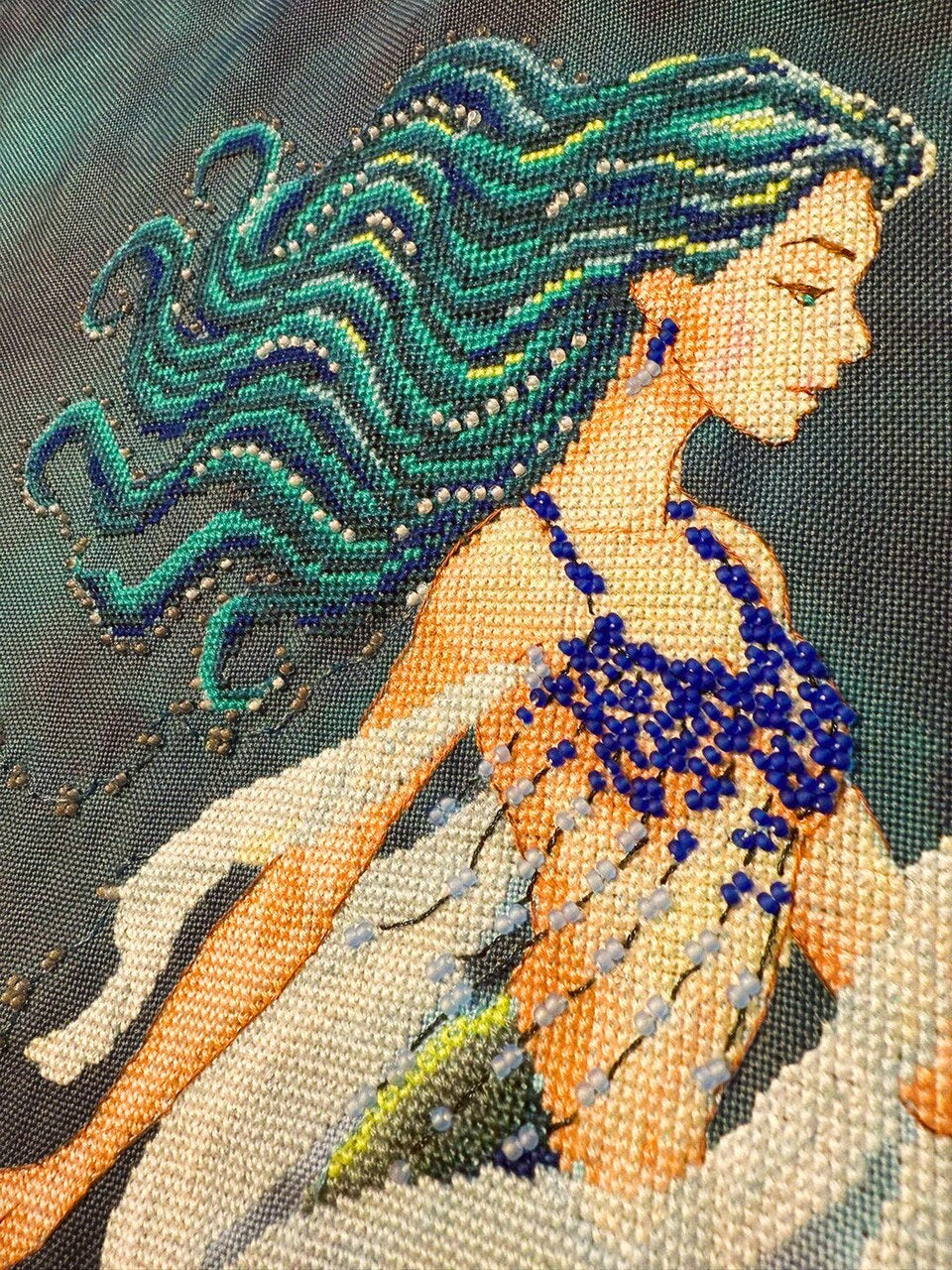 Close-up of blue bead and thread details